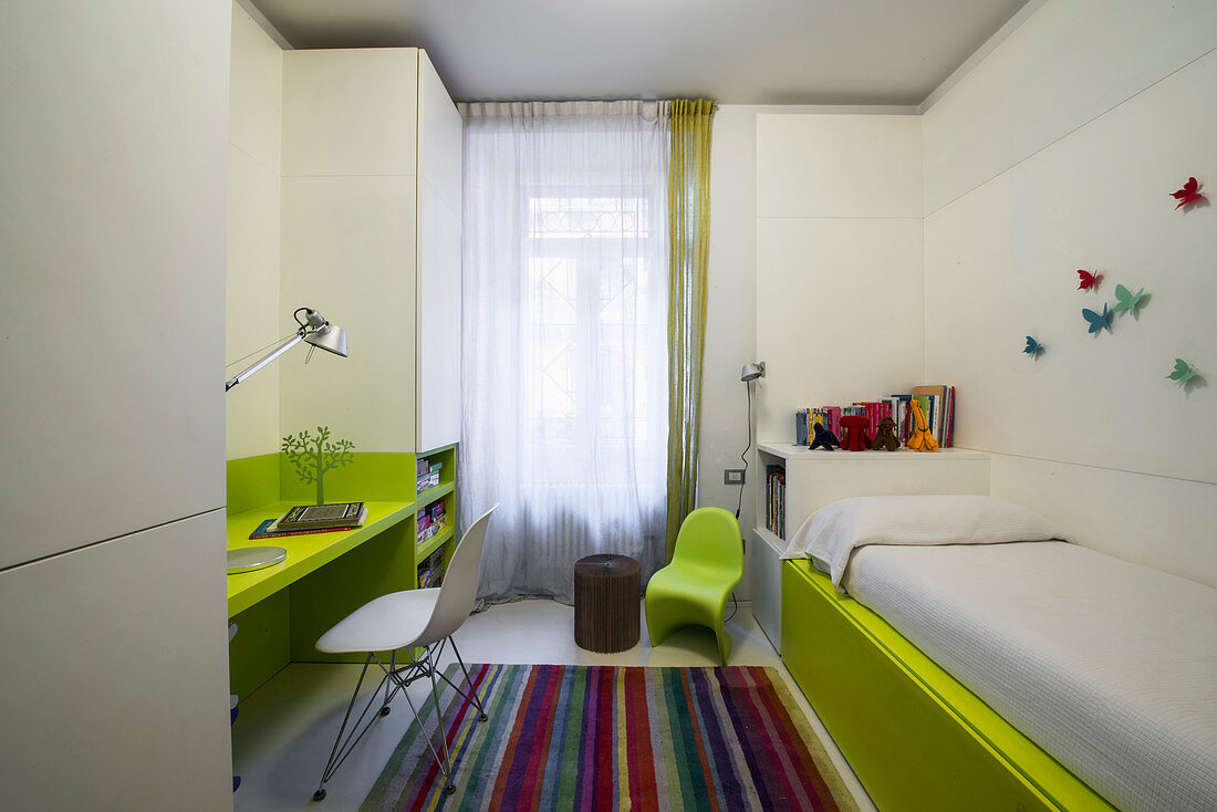 Green and white fitted elements in child's bedroom