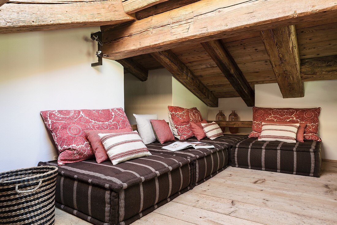 Floor couch with scatter cushions in attic living room