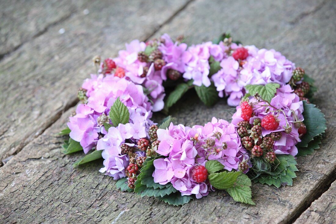 Luxuriant wreath of hydrangeas, berries and leaves