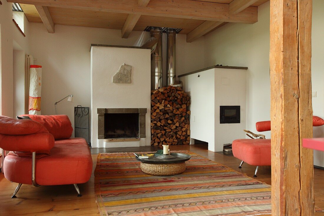 Fireplace and stacked firewood in lounge area