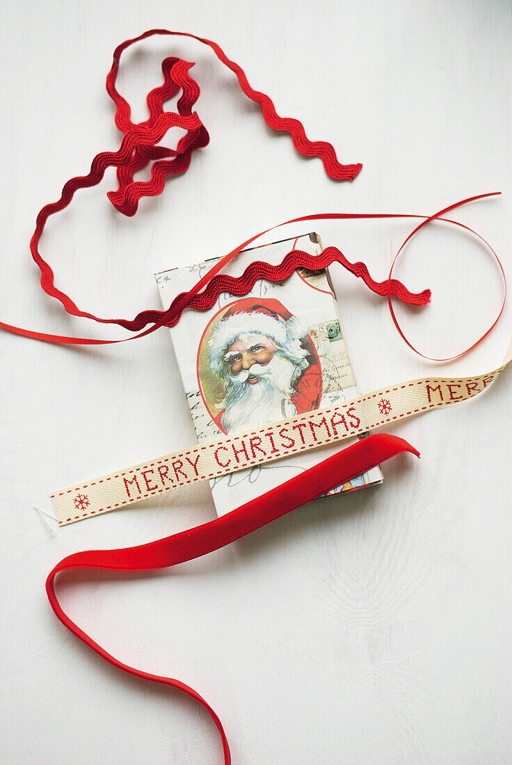 Box of matches covered with vintage Father Christmas motif and ribbons