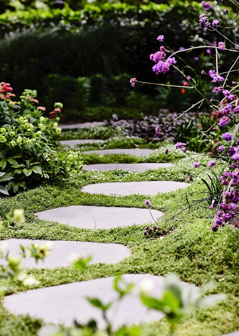 Garden path made of ingrown tread plates