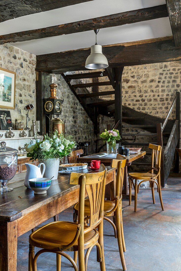 Old wooden furniture and stone wall in breakfast room