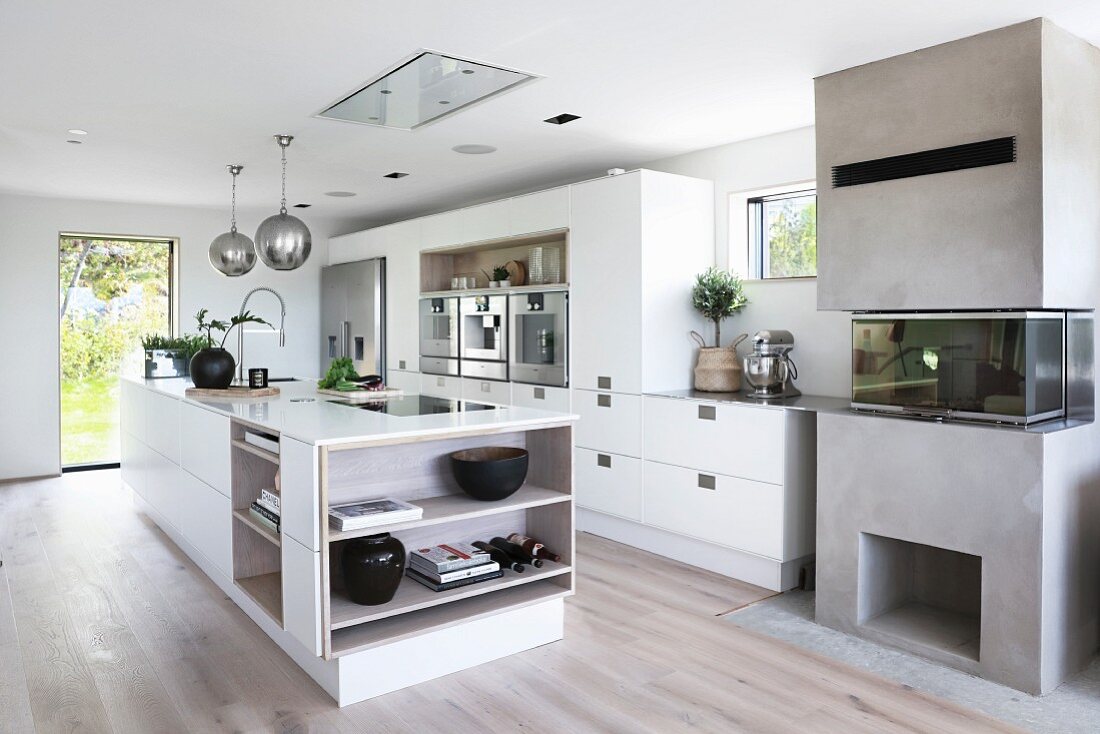 Free-standing counter in white designer kitchen