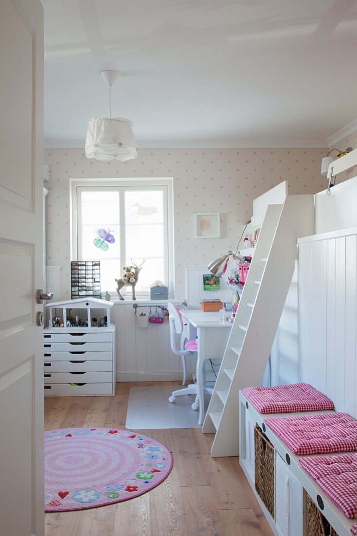 Desk and loft bed in pretty bedroom