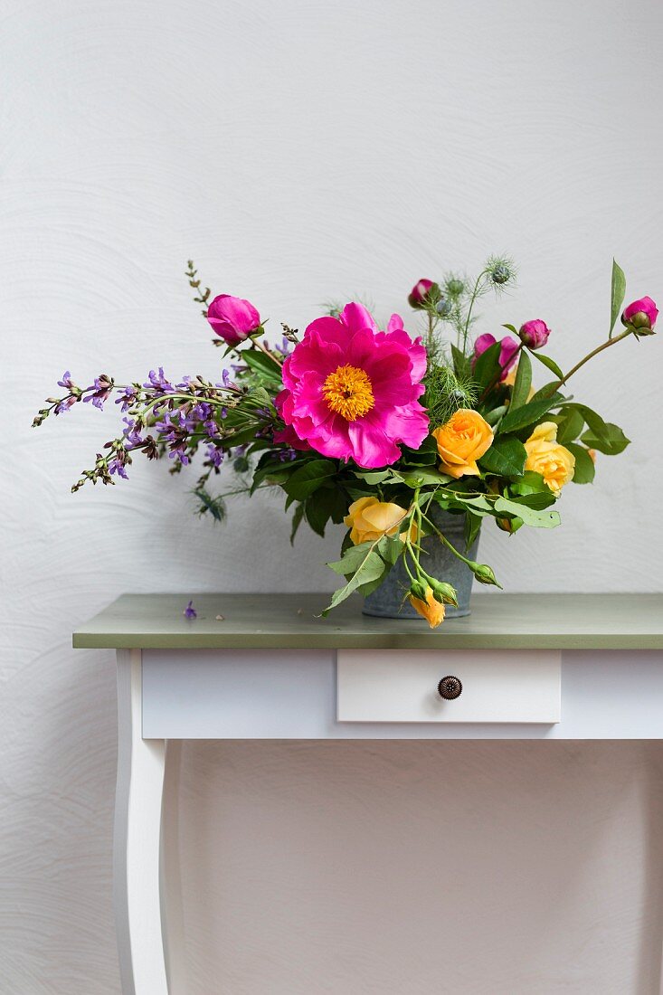 Spring bouquet of roses, peonies and salvia