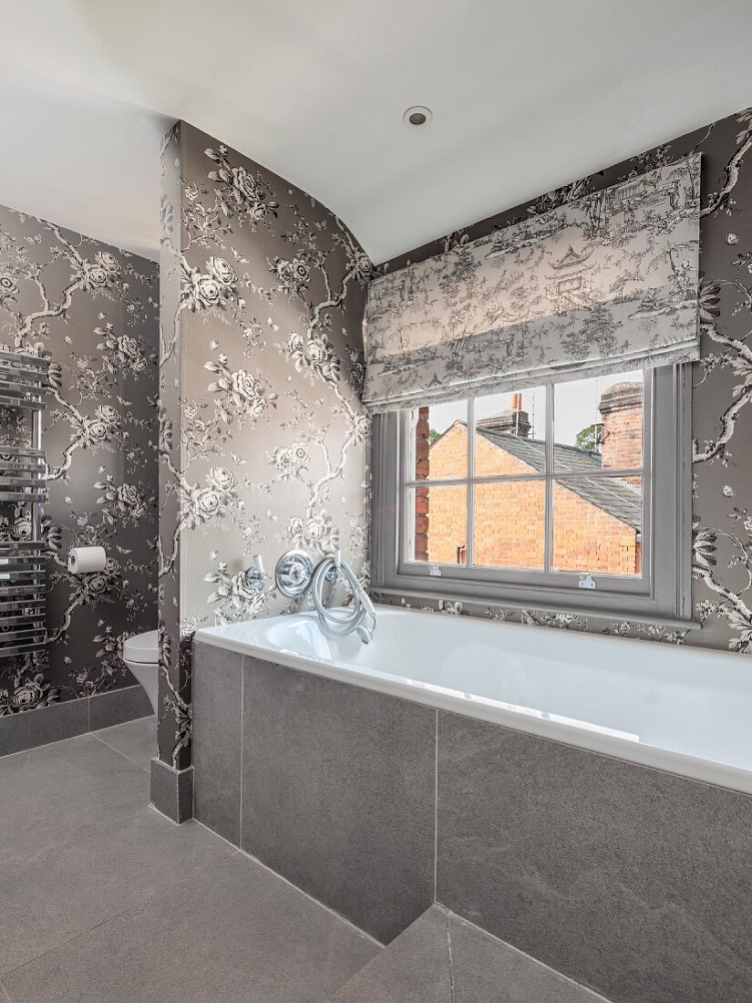 Elegant bathroom in shades of grey with floral wallpaper