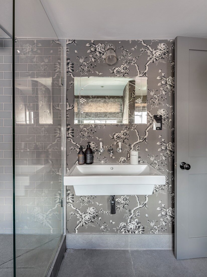Elegant bathroom in shades of grey with floral wallpaper