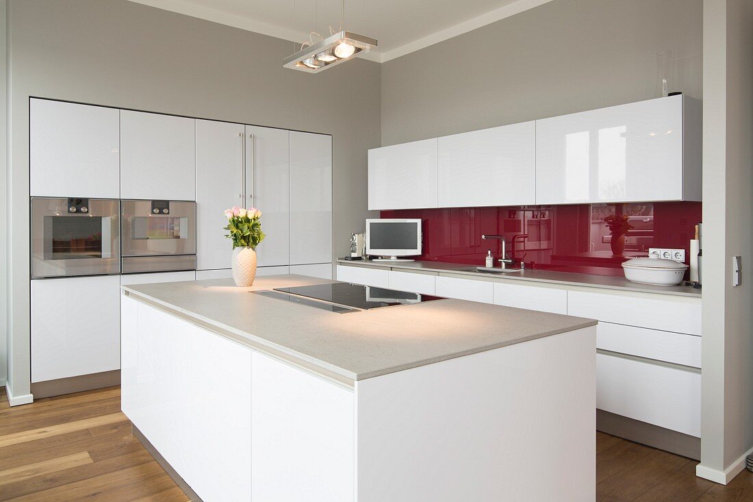 Interior of modern flat; kitchen with free-standing kitchen block