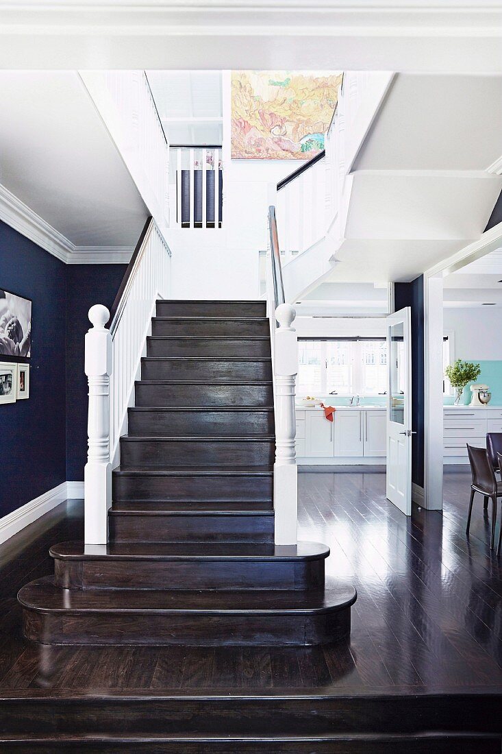 Freestanding stairs with dark wooden steps in the open living room