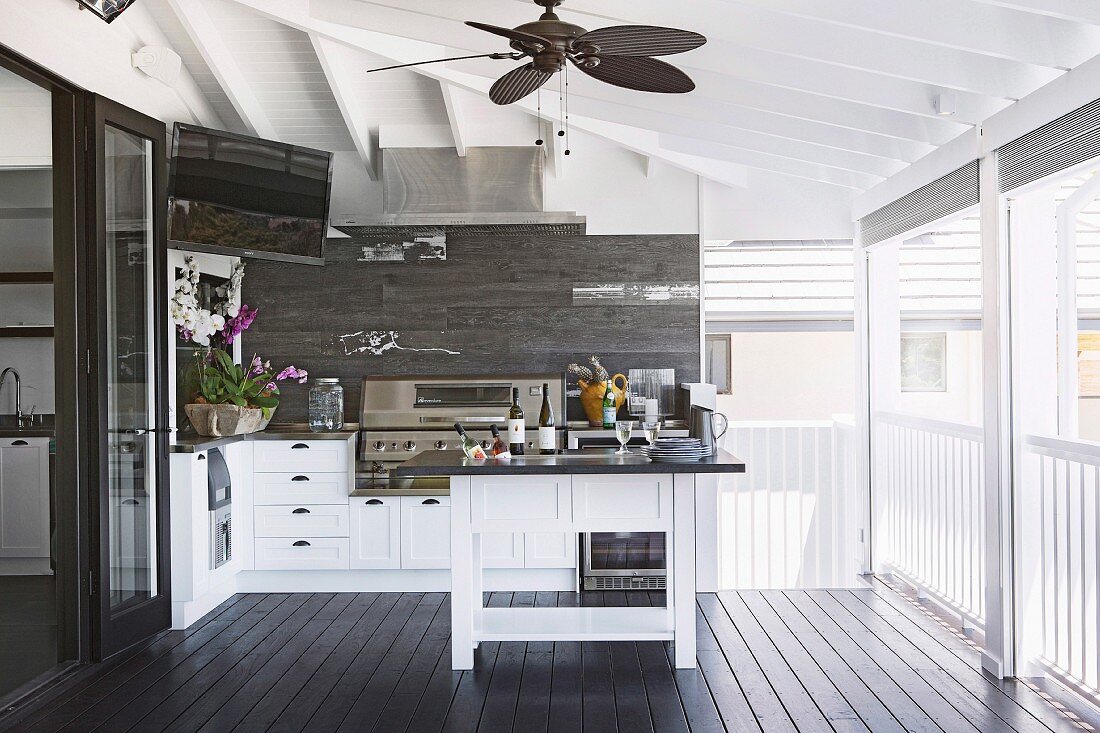 White country house kitchen on covered terrace