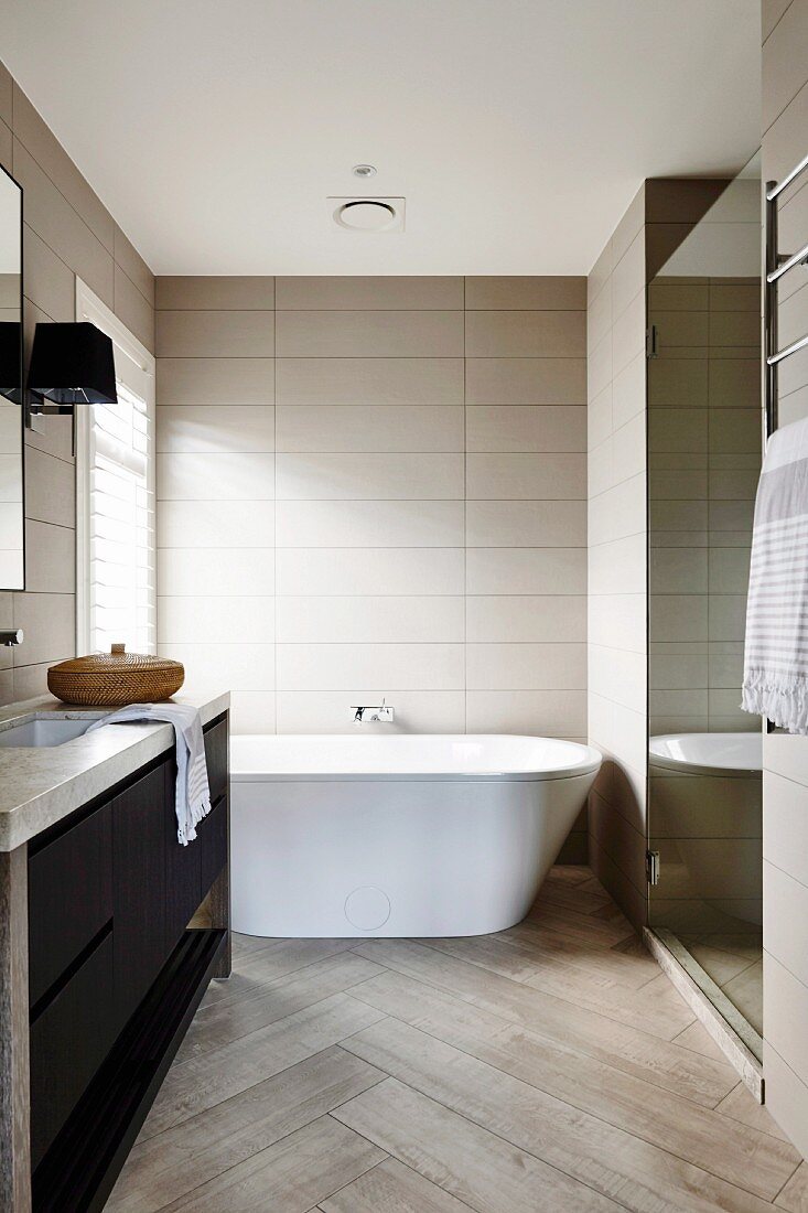 Modern bathroom in gray tones with herringbone pattern