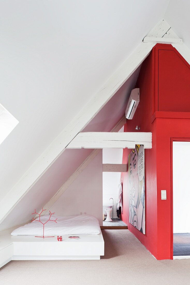 Bedroom with red wall in attic
