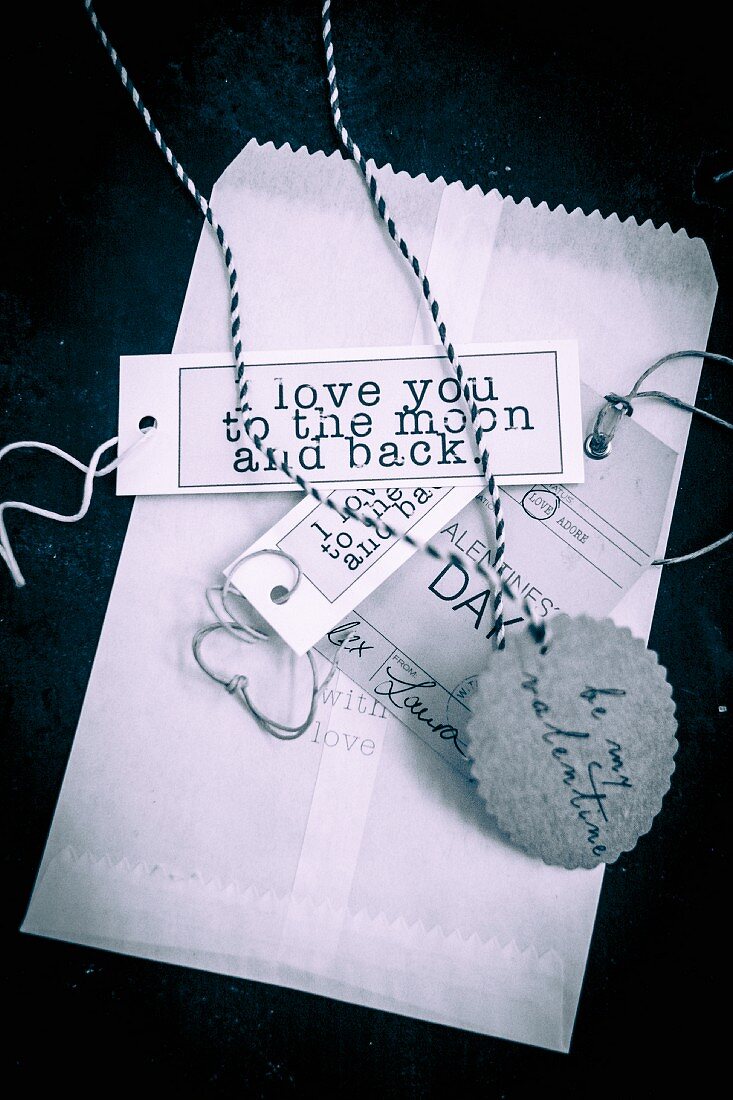 Paper bag and labelled paper tags for St. Valentine's Day