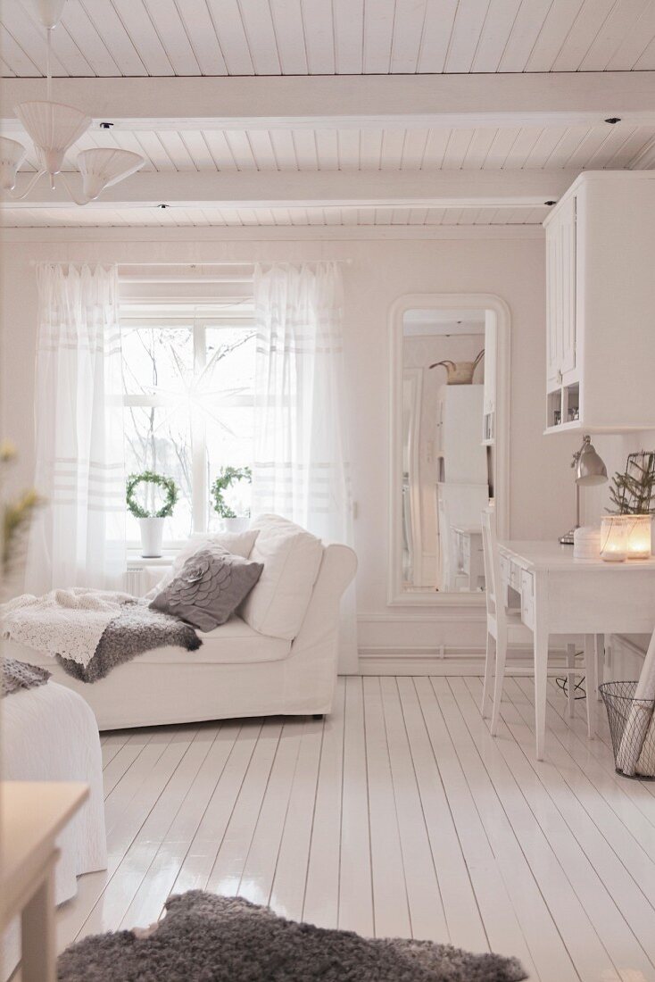 Chaise and desk in bedroom all in white