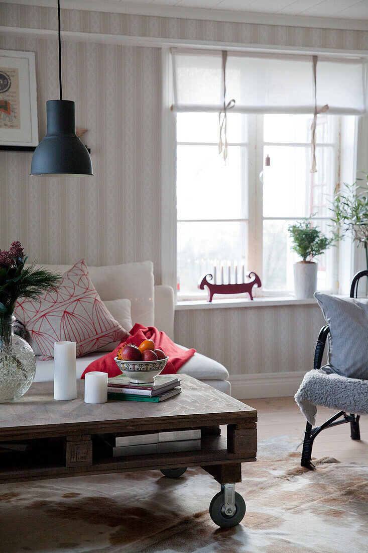 Coffee table made from pallet on castors in festively decorated living room