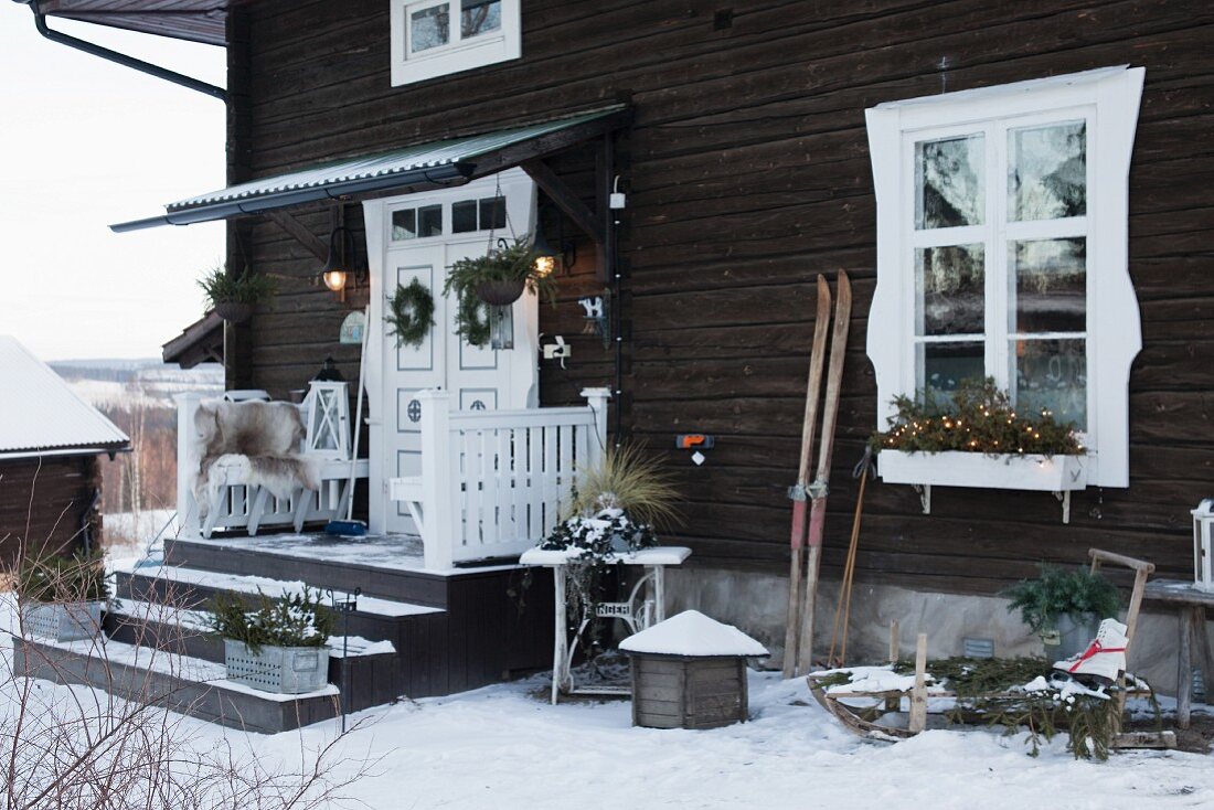 Festively decorated entrance to wooden house