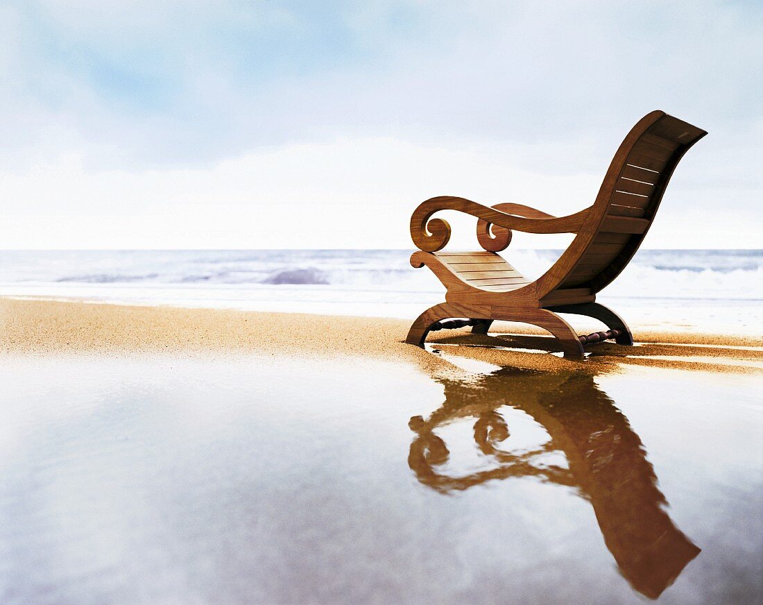 Lounger with curved backrest on beach