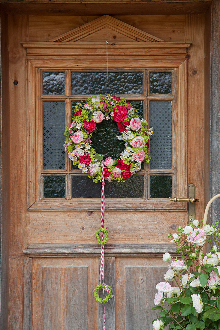 Wreath of roses and lady's mantle on front door