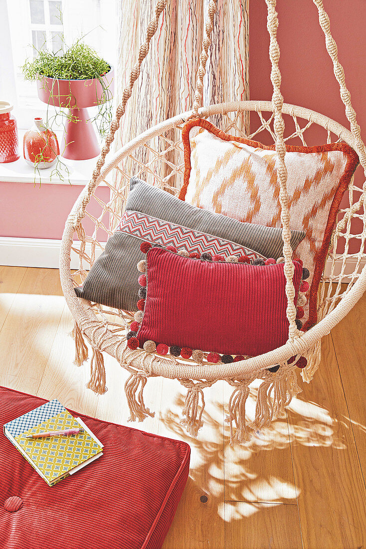 Decorative cushions on a swing chair in the living room