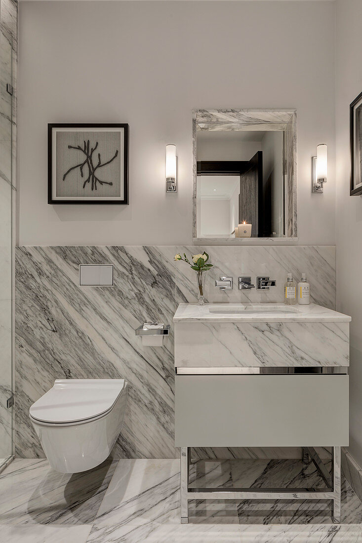 Clear lines and large marble panels in modern bathroom