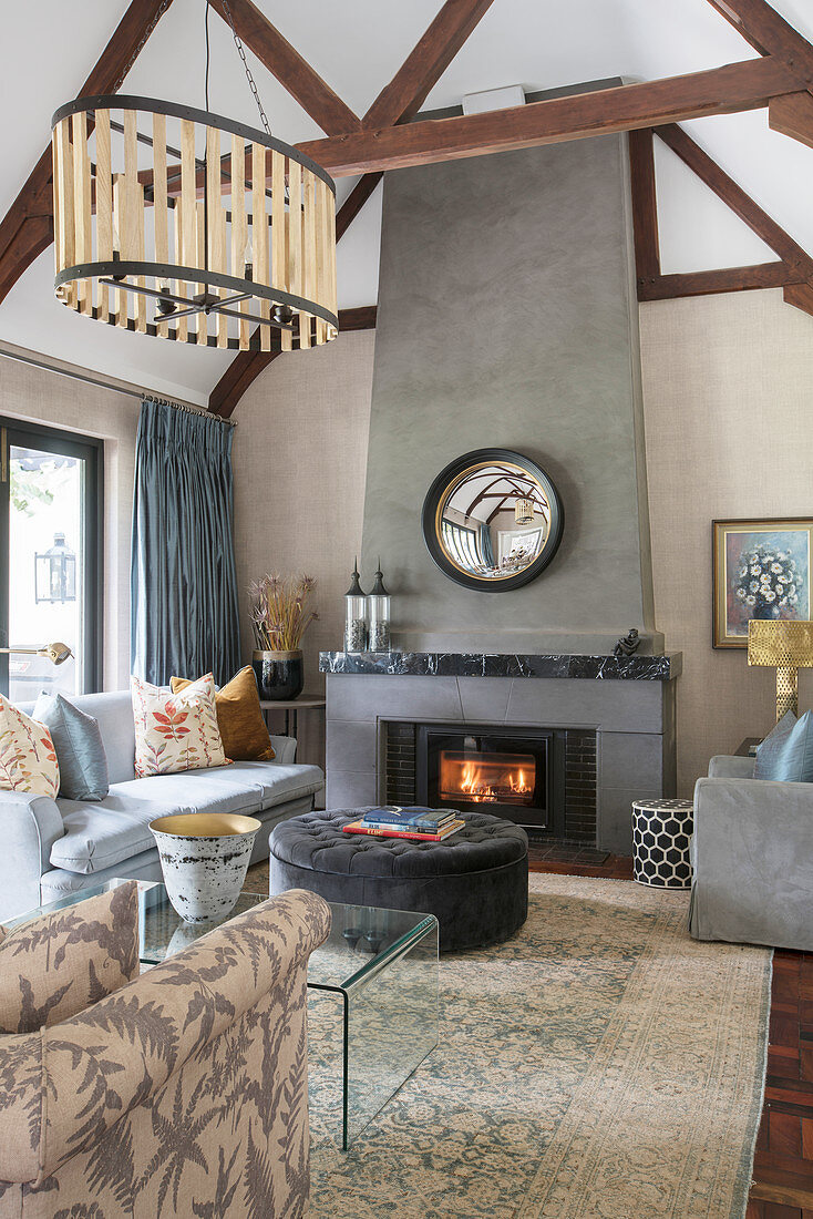 Beige and taupe wall in living room with fireplace and wood-beamed ceiling