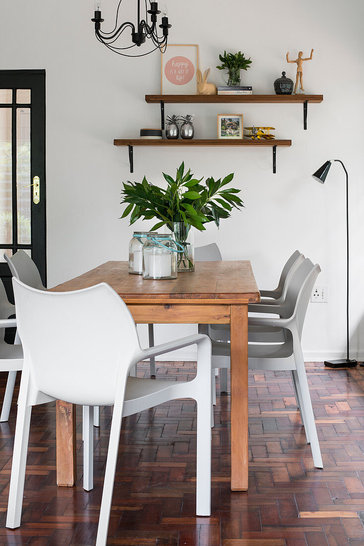 Wooden dining table and designer chairs
