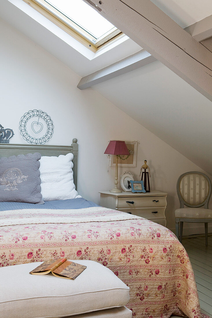 French-style attic bedroom under sloping ceiling
