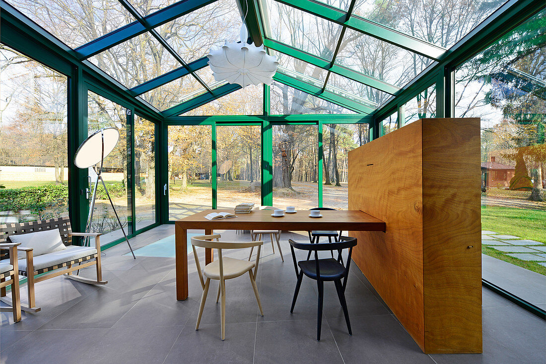 Dining table and chairs in modern conservatory