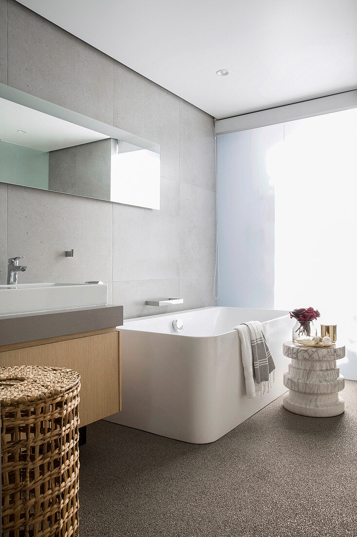 Large bathtub in modern, minimalist bathroom