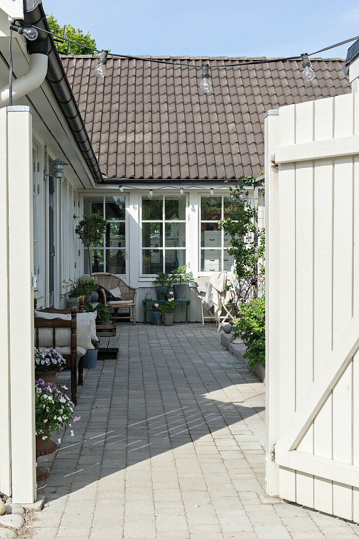 Open gate leading into courtyard of Swedish house