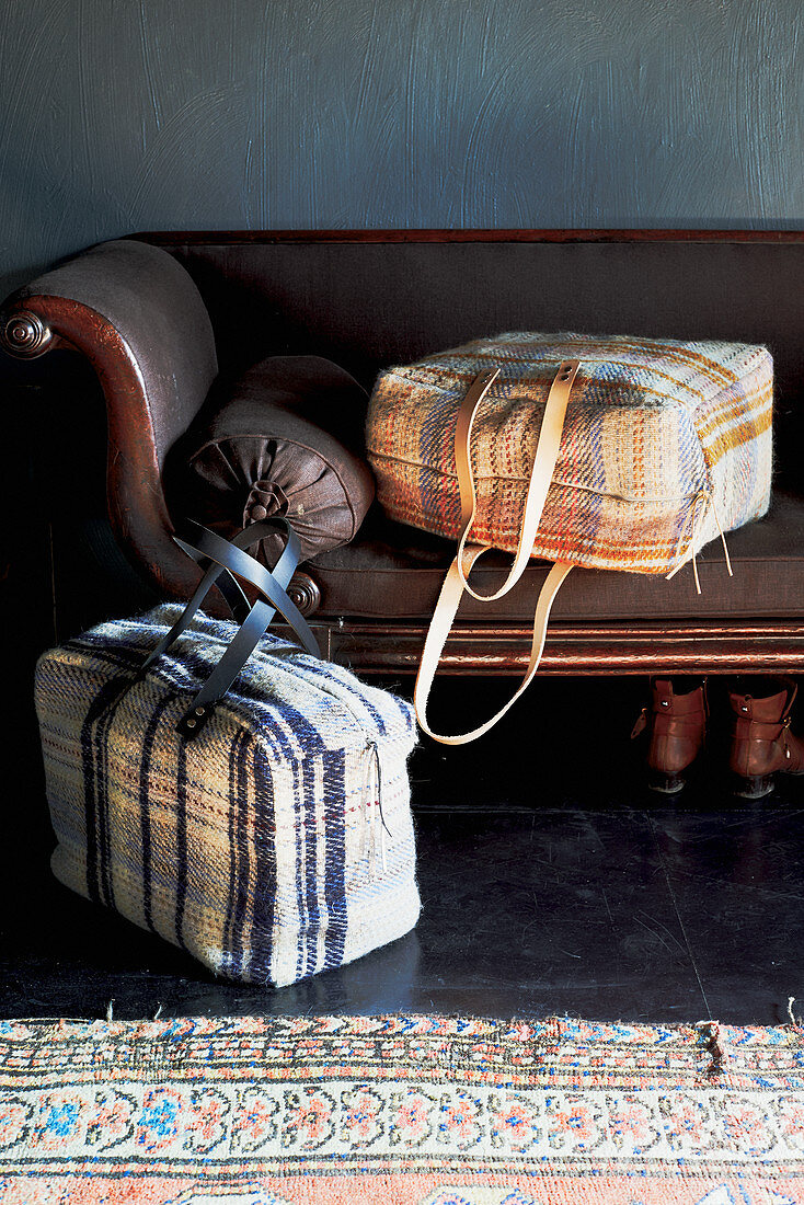 Hand-sewn, tartan, fabric bags on old sofa