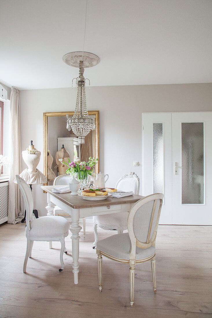 Medallion chairs around dining table in grey-and-white dining room