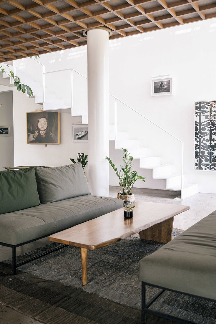 Lounge with gray sofas and designer coffee table