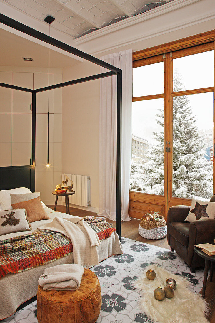 Four-poster bed in wintry bedroom in natural shades