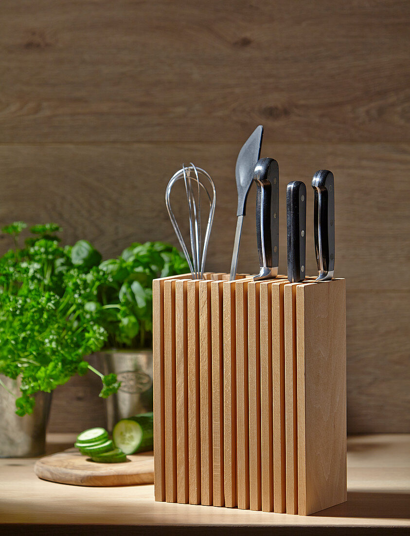 Wooden organiser and knife block in kitchen
