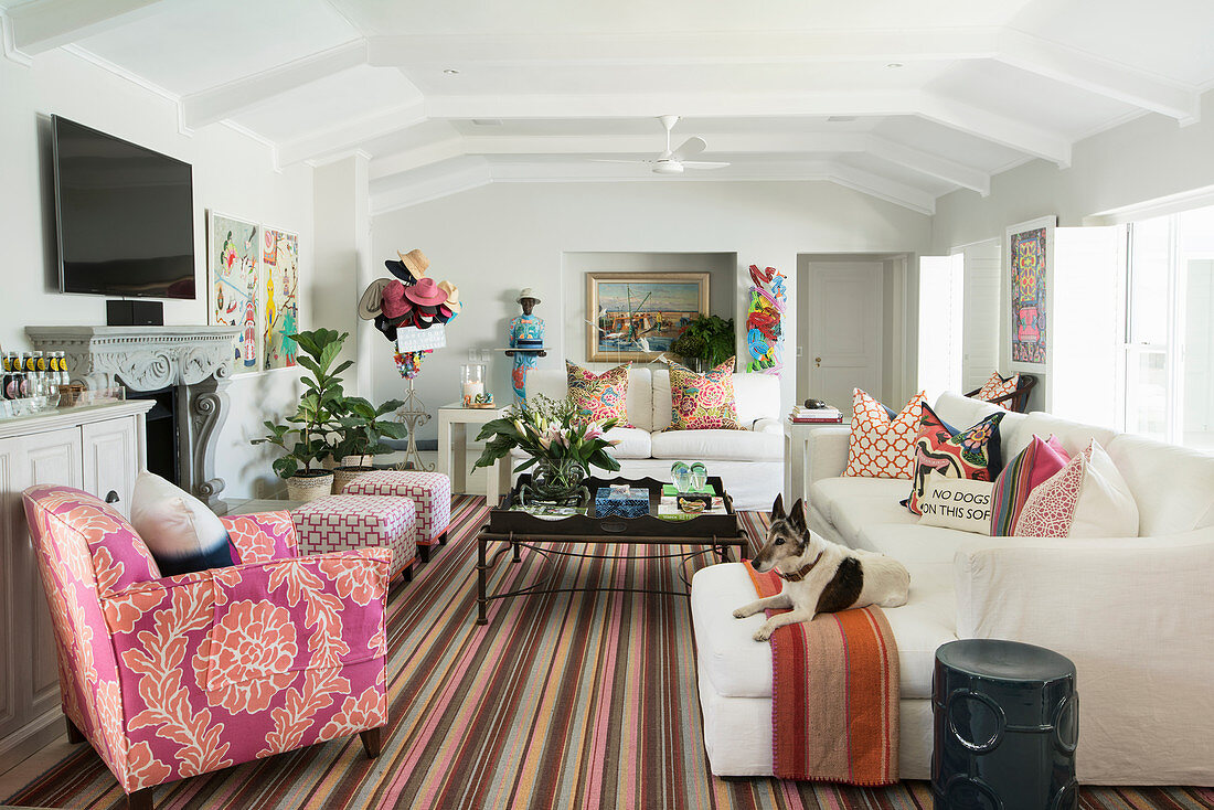 Striped rug in white living room with colourful accessories