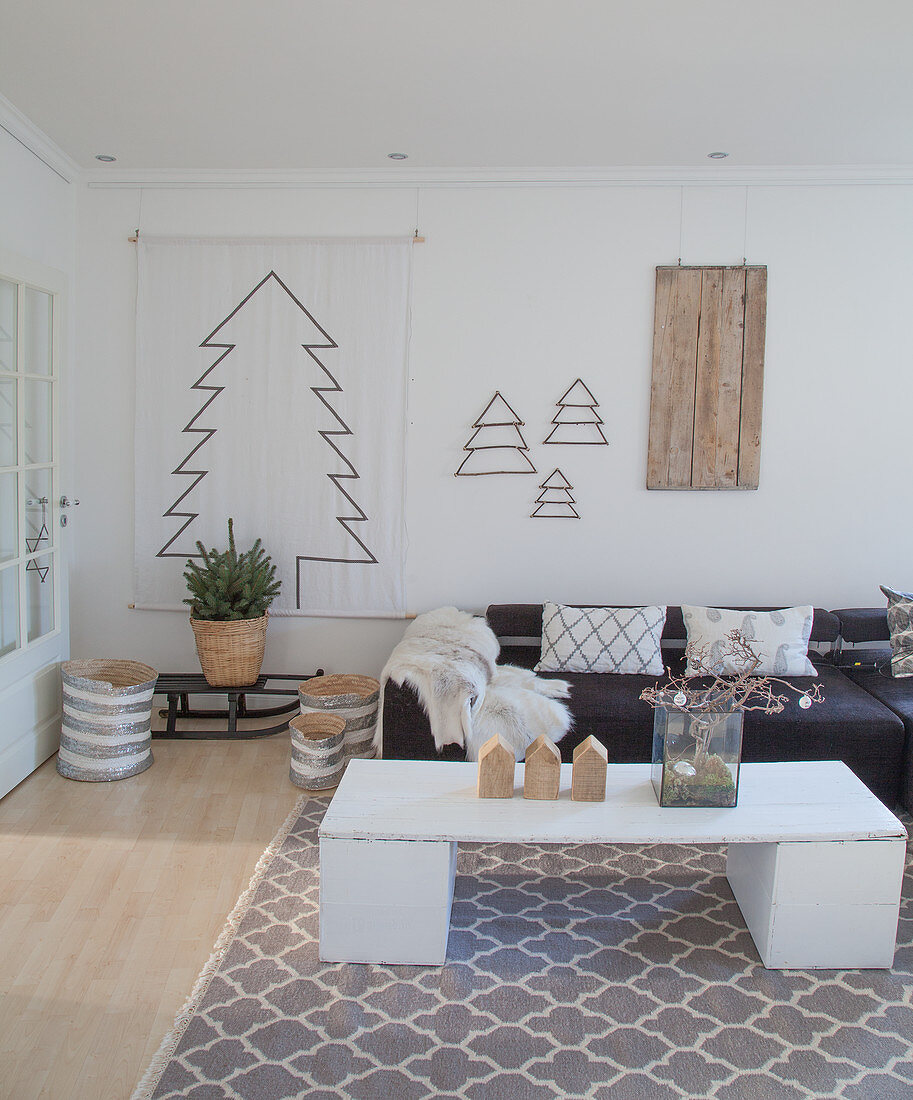 Stylised Christmas tree and DIY coffee table in bright living room