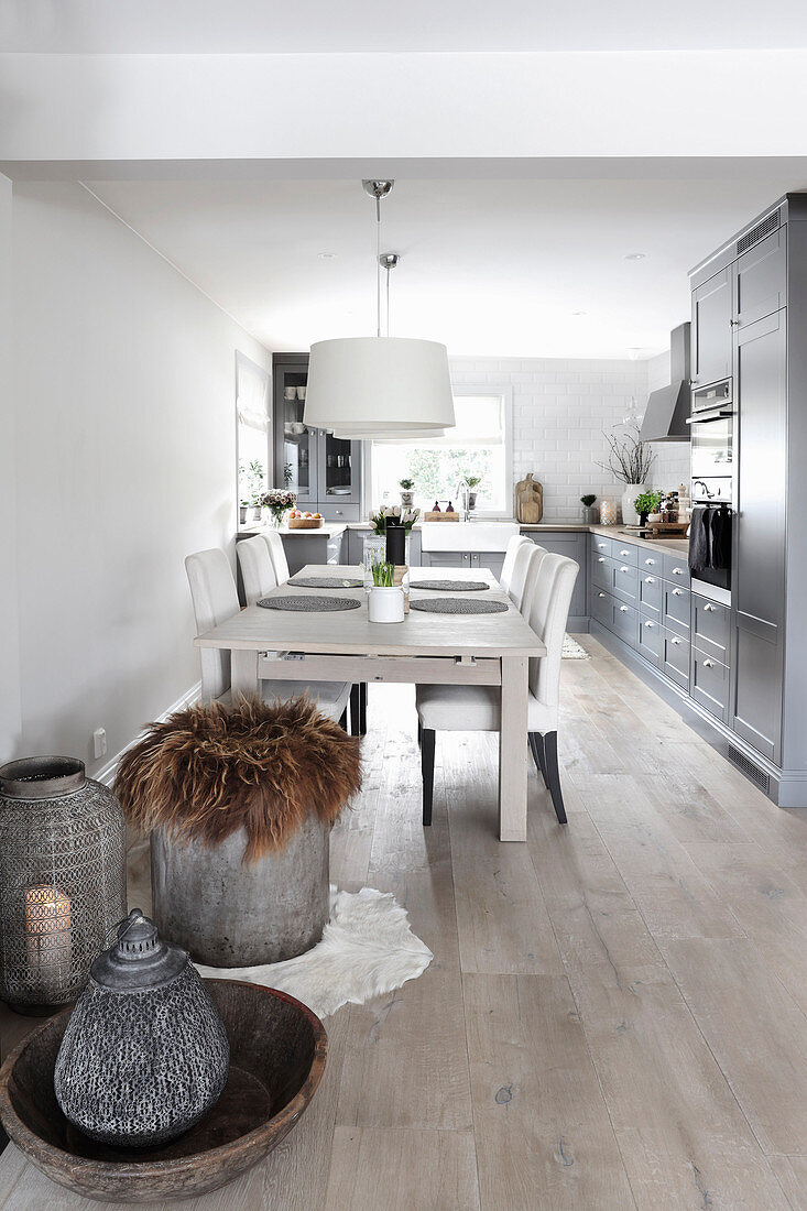 Dining table and upholstered chairs in open-plan kitchen