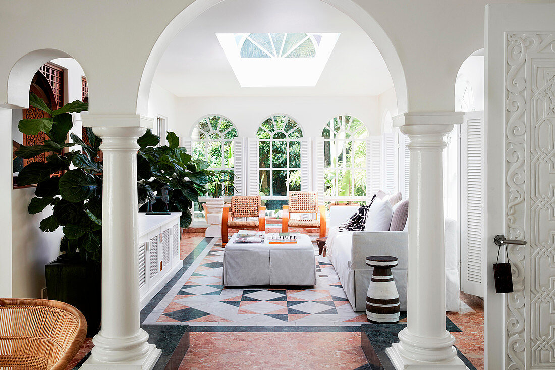 Elegant lounge area with arched passage