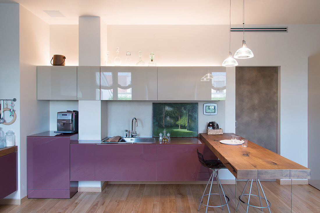 Designer kitchen with counter made from rustic wooden board