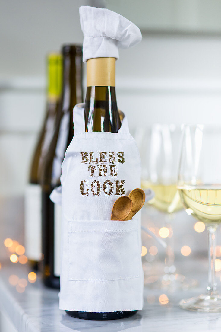 Bottle of wine dressed as a chef