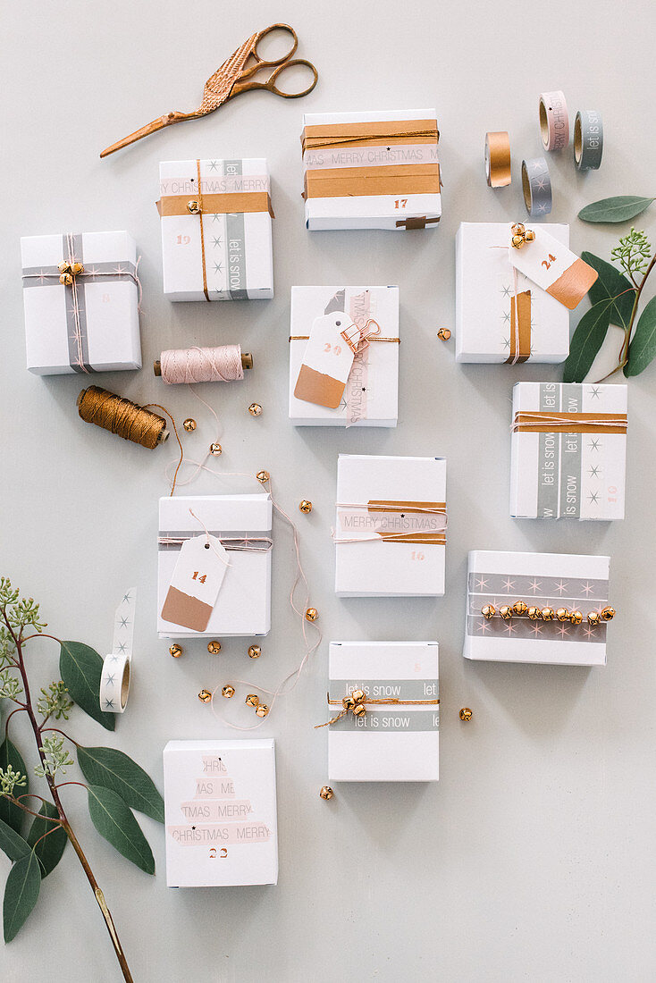 White boxes decorated with washi tape and string