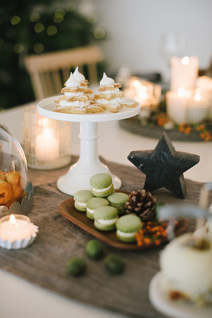 Sweet pastries on festively decorated dining table