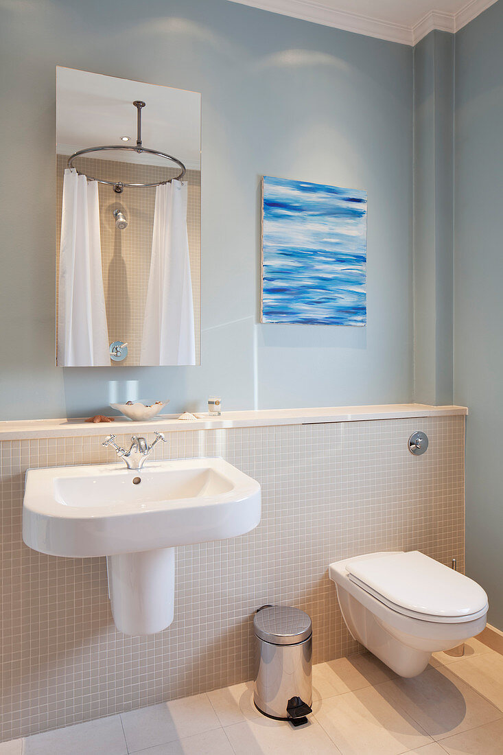 Maritime bathroom in pale blue and sandy shades