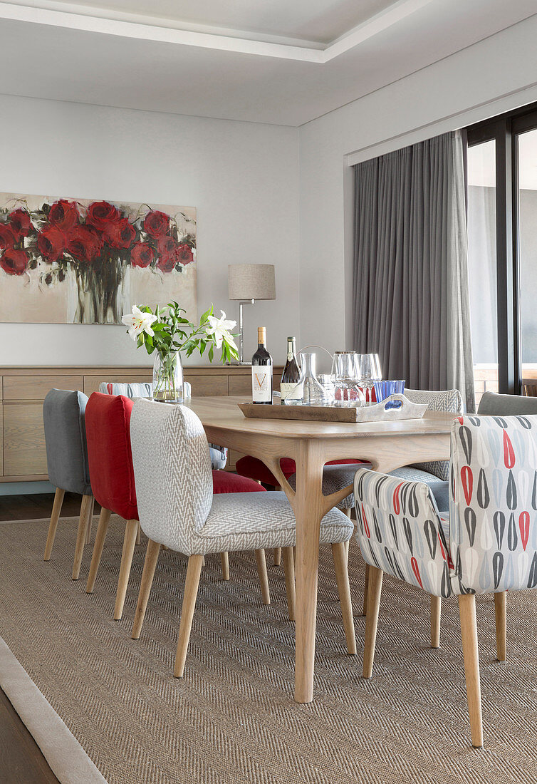 Dining table and chairs upholstered in grey and red