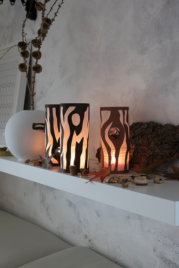 Handmade tealight holders with tree-trunk motif