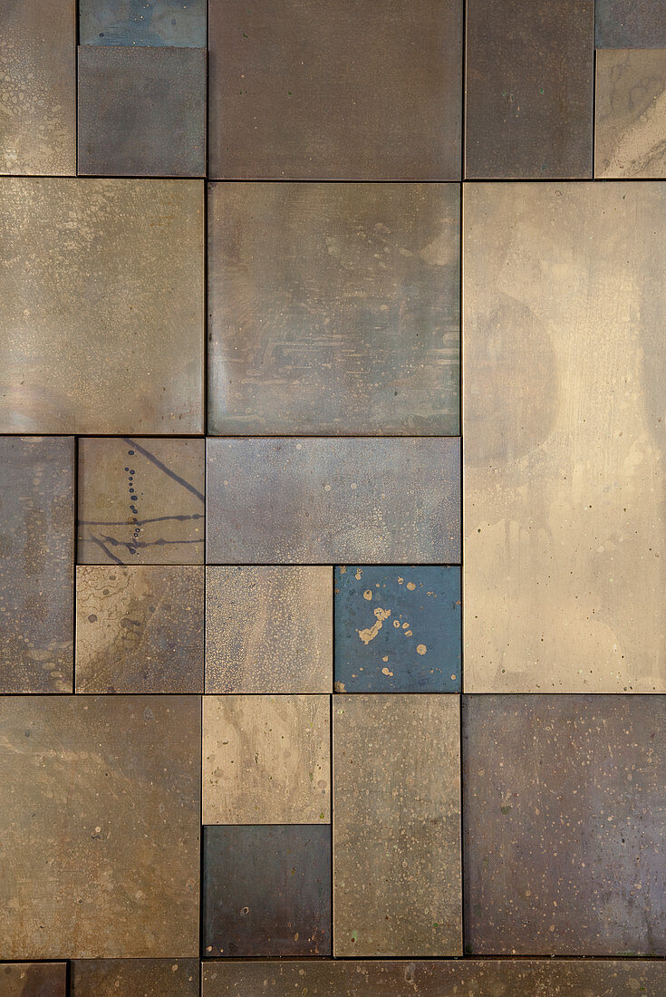 Bronze tiles of various sizes