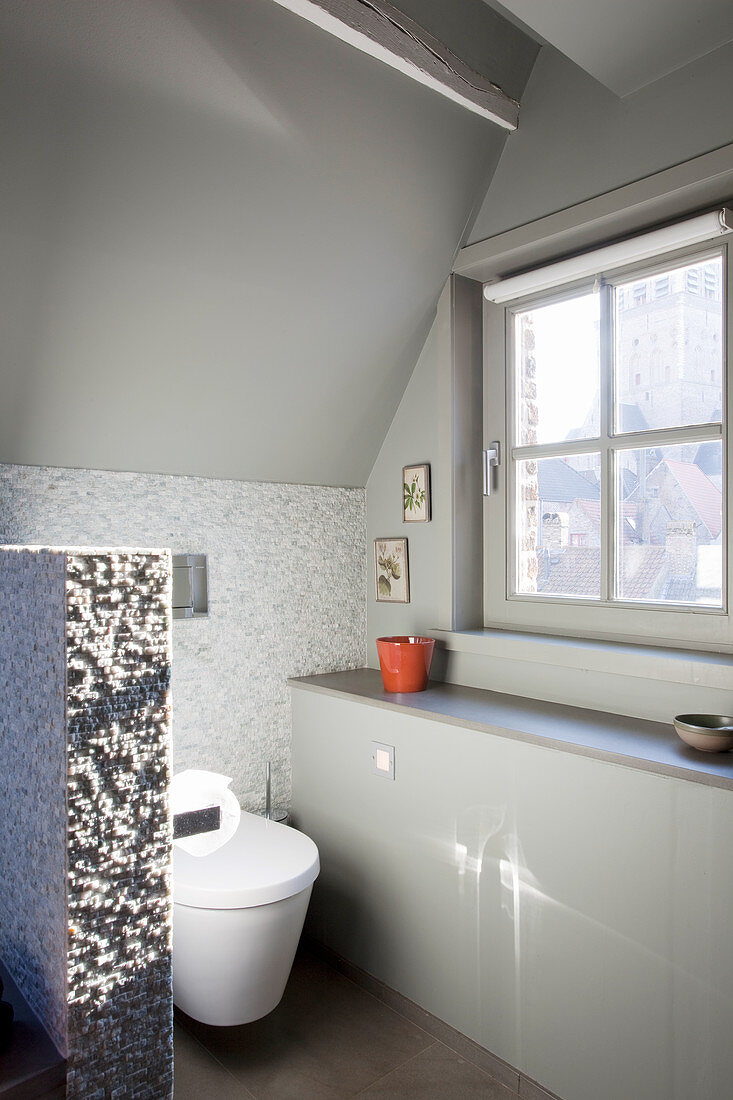 Elegant attic bathroom in shades of grey