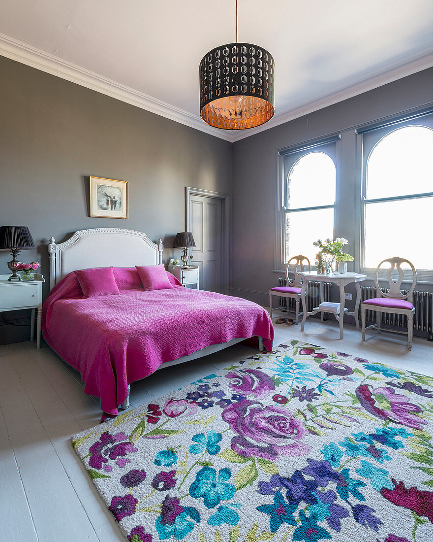 Feminine bedroom with grey walls and arched windows